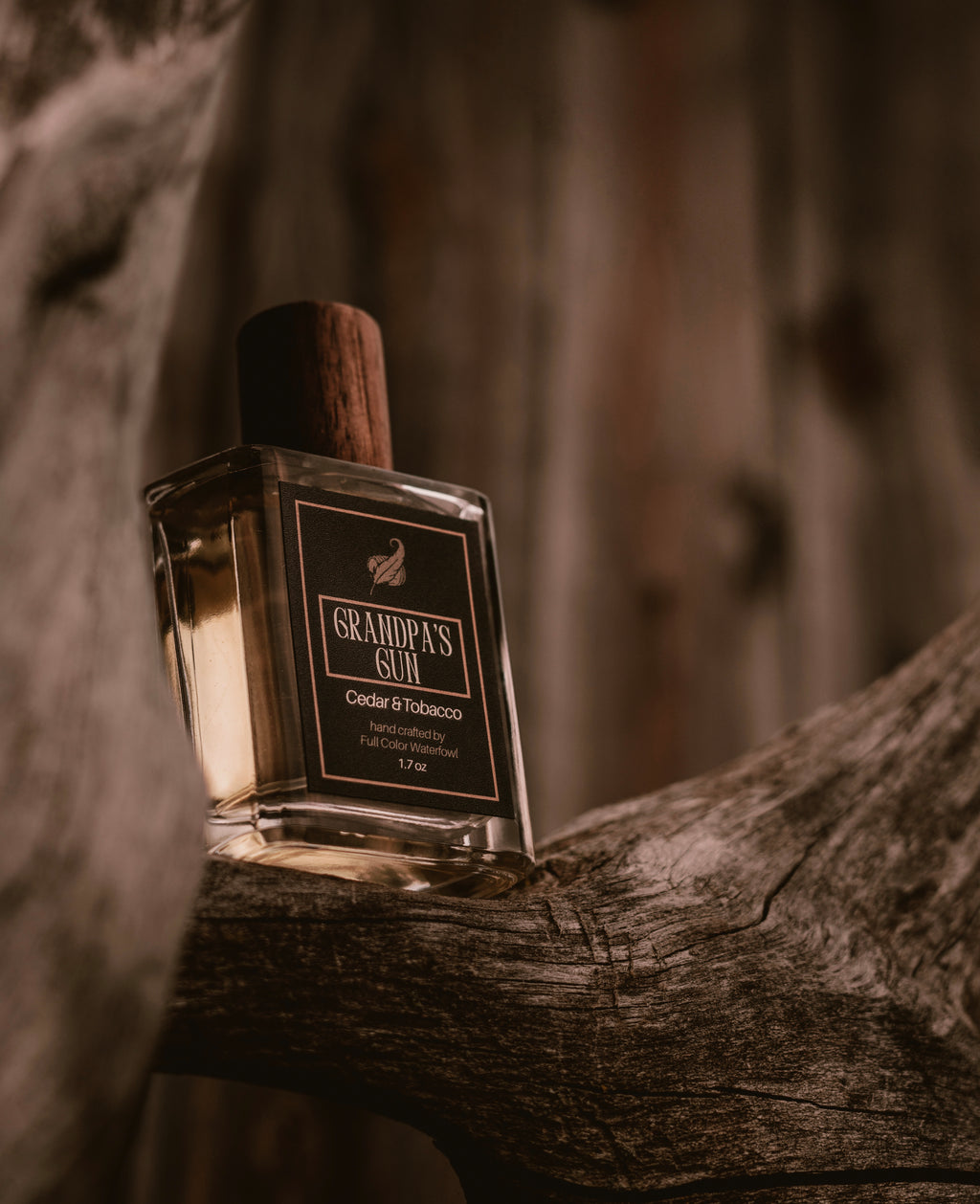 Bottle of 'Grandpa's Rum' on a wooden surface with a blurred background