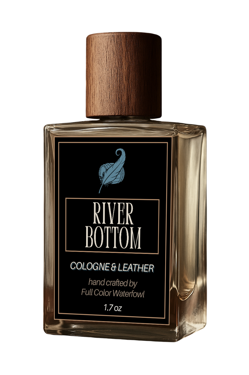 Perfume bottle labeled 'River Bottom Cologne & Leather' with a wooden cap on a white background